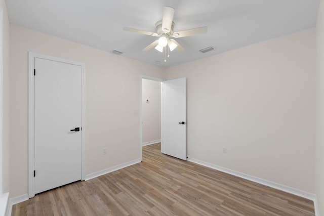 136 Oak Terrace Dr, Crestview, FL 32539 - unfurnished bedroom with light wood-style floors and a ceiling fan