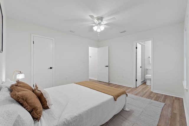 136 Oak Terrace Dr, Crestview, FL 32539 - bedroom featuring light wood-style floors, ensuite bath, and ceiling fan