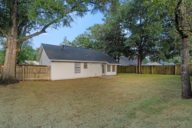 136 Oak Terrace Dr, Crestview, FL 32539 - back of property featuring a fenced backyard and a shingled roof