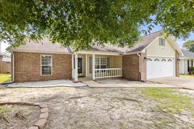 4601 Top Flight Dr, Crestview, FL 32539 - single story home featuring brick siding, a porch, an attached garage, concrete driveway, and roof with shingles