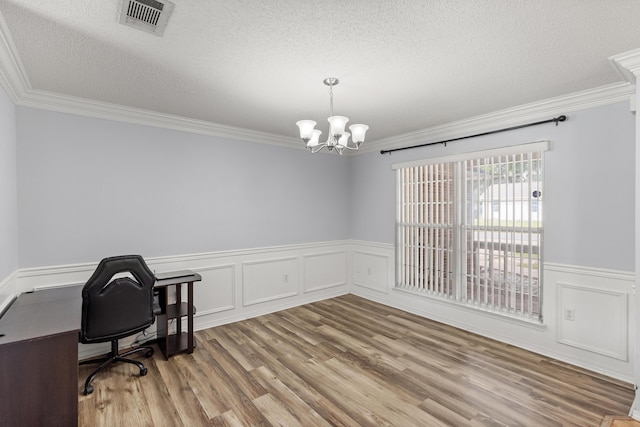 4601 Top Flight Dr, Crestview, FL 32539 - unfurnished office featuring ornamental molding, a textured ceiling, a chandelier, wainscoting, and wood finished floors