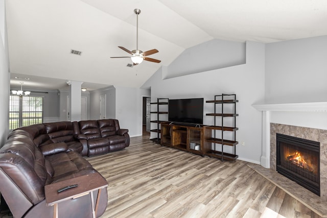 4601 Top Flight Dr, Crestview, FL 32539 - living area with a fireplace, wood finished floors, a ceiling fan, a chandelier, and high vaulted ceiling