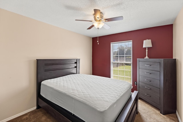 4601 Top Flight Dr, Crestview, FL 32539 - bedroom featuring carpet, a textured ceiling, and ceiling fan