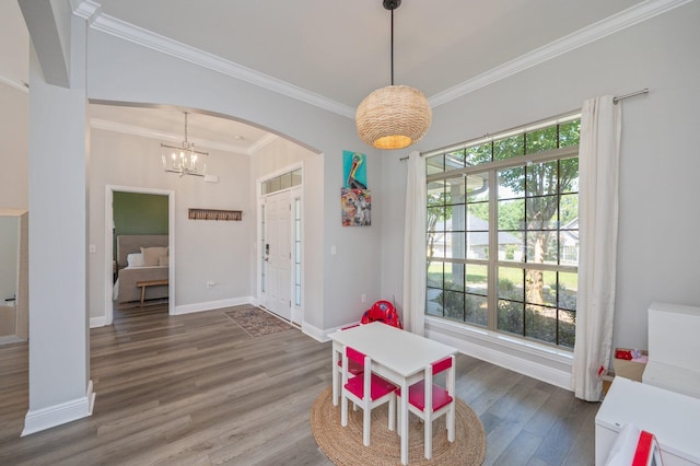 138 Crab Apple Ave, Crestview, FL 32536 - playroom with arched walkways, wood finished floors, crown molding, and a chandelier