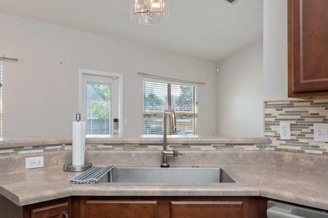 138 Crab Apple Ave, Crestview, FL 32536 - kitchen featuring healthy amount of natural light, tasteful backsplash, a chandelier, and stainless steel dishwasher