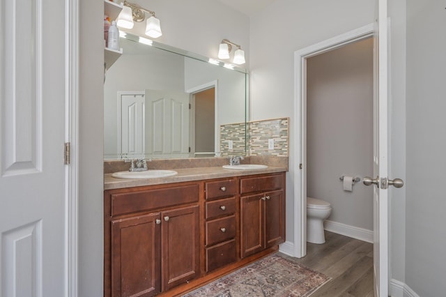 138 Crab Apple Ave, Crestview, FL 32536 - full bathroom with double vanity and wood finished floors