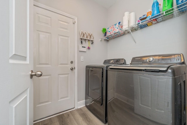 138 Crab Apple Ave, Crestview, FL 32536 - laundry room with washing machine and dryer and wood finished floors