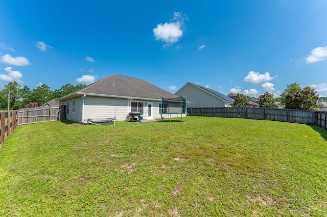 138 Crab Apple Ave, Crestview, FL 32536 - fenced backyard with a trampoline