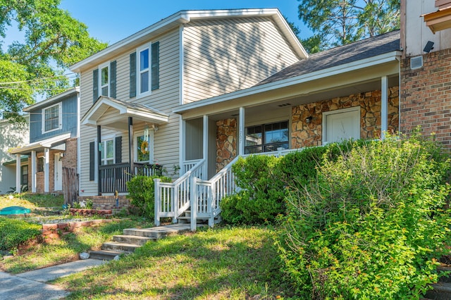 1207 Walter Ave, Crestview, FL 32536 - view of front of home featuring a porch and stone siding