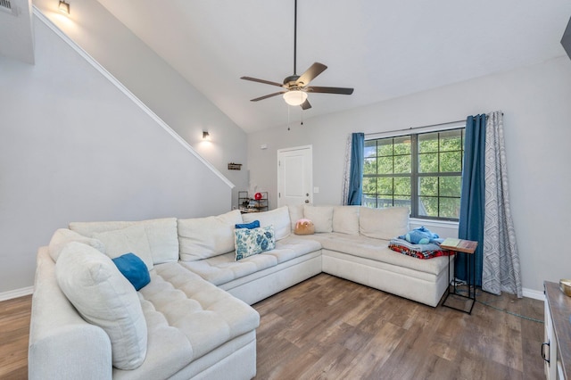 1207 Walter Ave, Crestview, FL 32536 - living area with ceiling fan, wood finished floors, high vaulted ceiling, and stairs