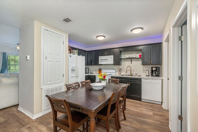 1207 Walter Ave, Crestview, FL 32536 - dining room with wood finished floors, ceiling fan, and a textured ceiling