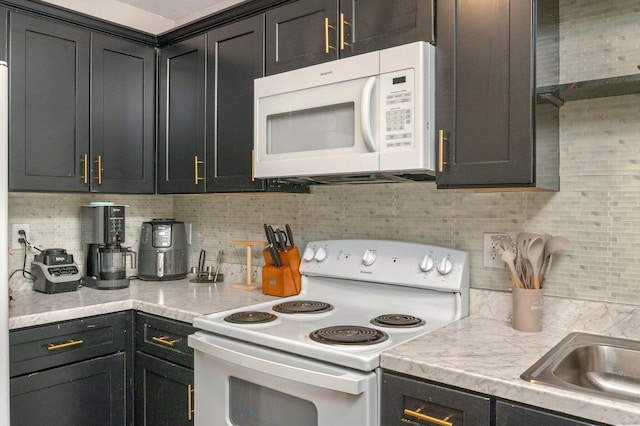 1207 Walter Ave, Crestview, FL 32536 - kitchen with white appliances and tasteful backsplash