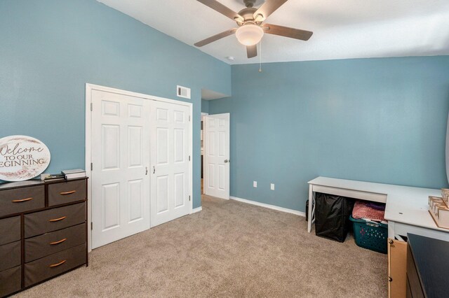 1207 Walter Ave, Crestview, FL 32536 - bedroom with light colored carpet, high vaulted ceiling, a ceiling fan, and a closet
