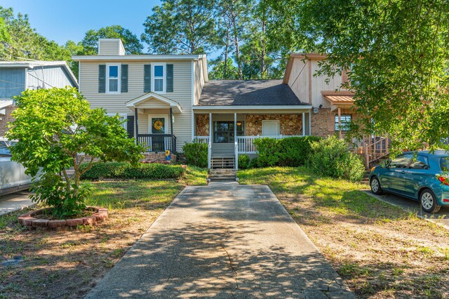 1207 Walter Ave, Crestview, FL 32536 - view of front of house featuring a porch and a chimney