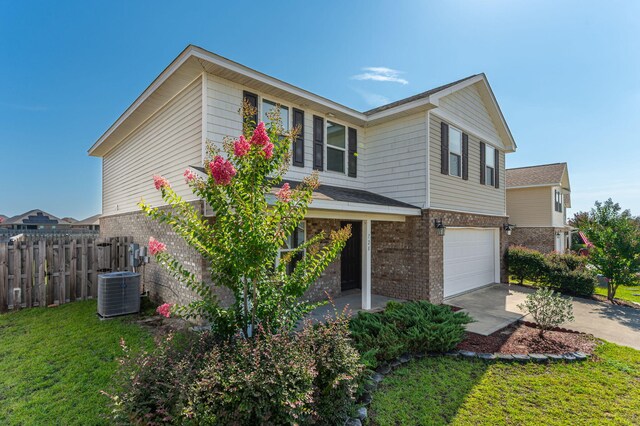 728 Widgeon Way, Crestview, FL 32539 - view of front of home featuring an attached garage, brick siding, and driveway