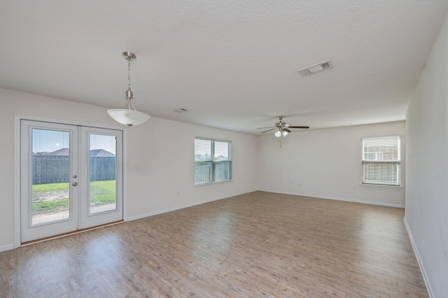 728 Widgeon Way, Crestview, FL 32539 - unfurnished room featuring wood finished floors, french doors, and ceiling fan