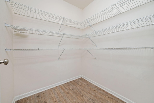 728 Widgeon Way, Crestview, FL 32539 - spacious closet featuring wood finished floors