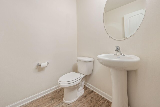 728 Widgeon Way, Crestview, FL 32539 - bathroom featuring wood finished floors and toilet