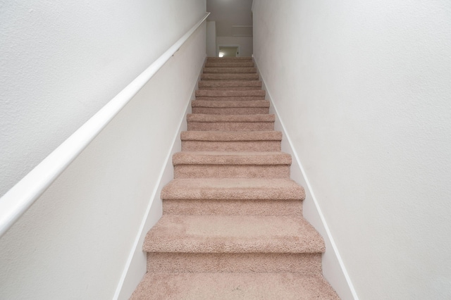 728 Widgeon Way, Crestview, FL 32539 - staircase featuring carpet floors