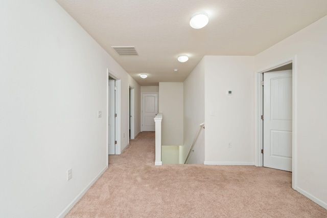 728 Widgeon Way, Crestview, FL 32539 - empty room featuring light colored carpet and a textured ceiling