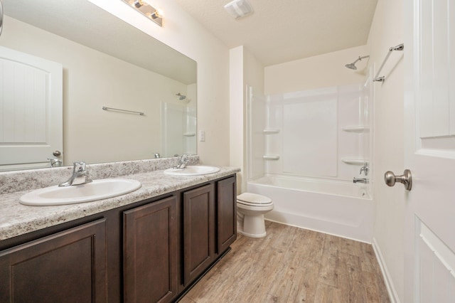 728 Widgeon Way, Crestview, FL 32539 - bathroom with double vanity, wood finished floors, and washtub / shower combination