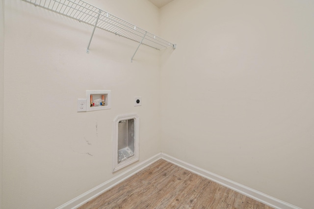728 Widgeon Way, Crestview, FL 32539 - laundry area featuring hookup for an electric dryer, light wood-style floors, and hookup for a washing machine