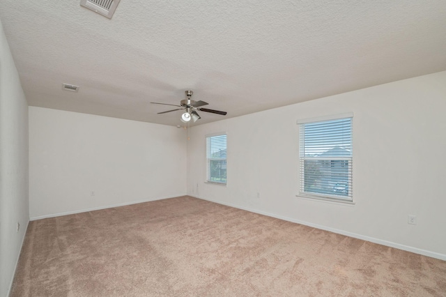 728 Widgeon Way, Crestview, FL 32539 - spare room with carpet flooring, a ceiling fan, and a textured ceiling