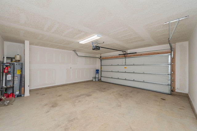 728 Widgeon Way, Crestview, FL 32539 - garage featuring a garage door opener and gas water heater