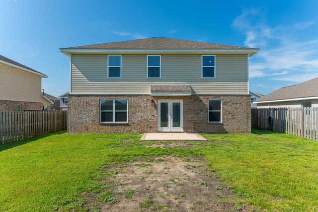 728 Widgeon Way, Crestview, FL 32539 - back of house with french doors, brick siding, a fenced backyard, and a patio area