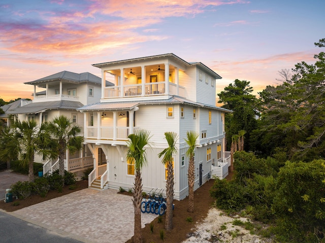 24 Barefoot Ln, Inlet Beach, FL 32461 - coastal home with a balcony, ceiling fan, and stairs