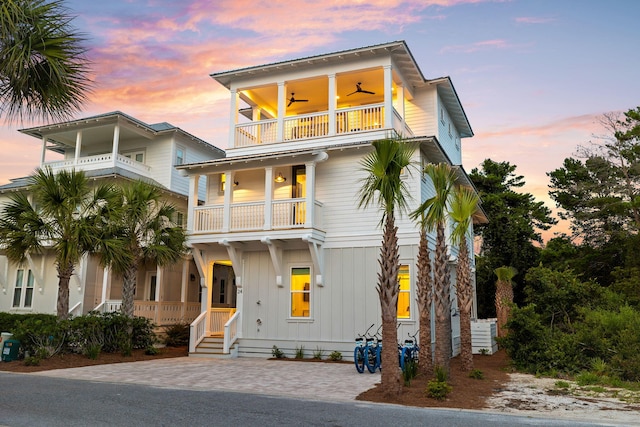 24 Barefoot Ln, Inlet Beach, FL 32461 - coastal home featuring a balcony, board and batten siding, and ceiling fan