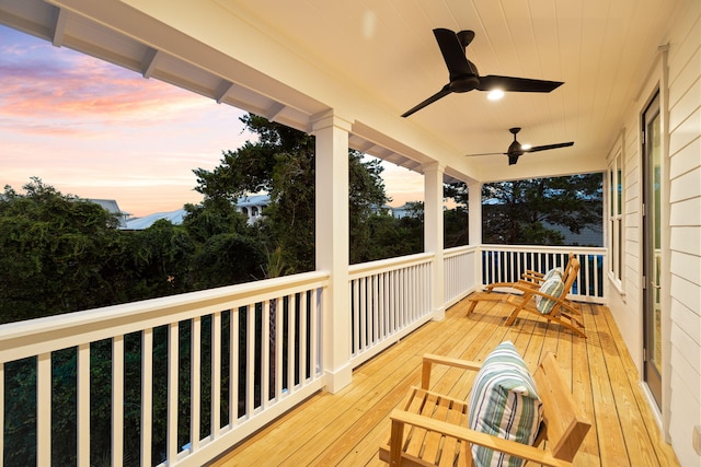 24 Barefoot Ln, Inlet Beach, FL 32461 - deck at dusk featuring a ceiling fan