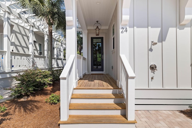 24 Barefoot Ln, Inlet Beach, FL 32461 - doorway to property featuring covered porch and board and batten siding