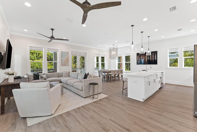 24 Barefoot Ln, Inlet Beach, FL 32461 - living area featuring recessed lighting, healthy amount of natural light, a ceiling fan, light wood finished floors, and ornamental molding