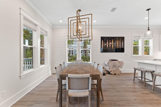 24 Barefoot Ln, Inlet Beach, FL 32461 - dining space with crown molding, a chandelier, wood finished floors, and recessed lighting