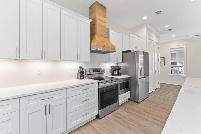 24 Barefoot Ln, Inlet Beach, FL 32461 - kitchen with stainless steel appliances, custom exhaust hood, white cabinets, light countertops, and recessed lighting