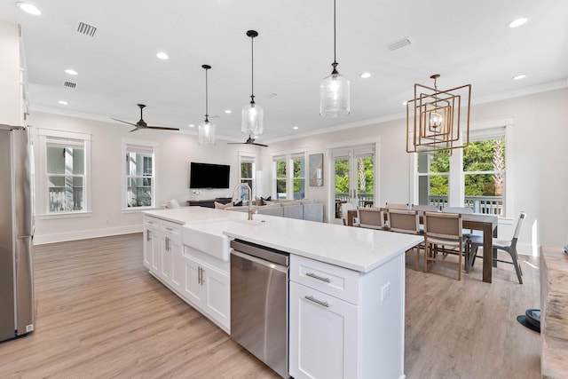 24 Barefoot Ln, Inlet Beach, FL 32461 - kitchen with appliances with stainless steel finishes, recessed lighting, ceiling fan, crown molding, and an island with sink