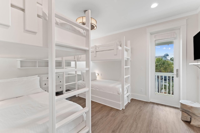 24 Barefoot Ln, Inlet Beach, FL 32461 - bedroom featuring access to exterior, wood finished floors, ornamental molding, and recessed lighting