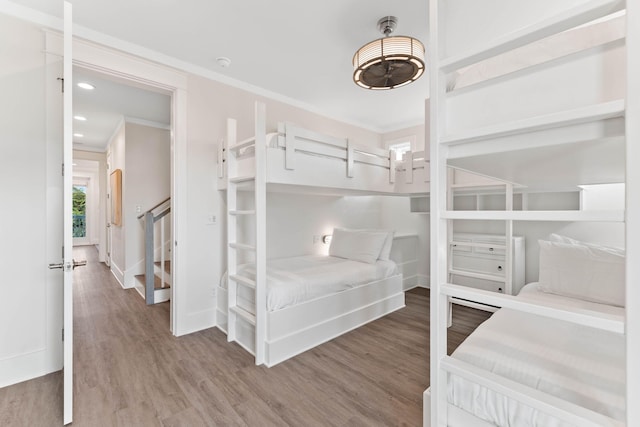 24 Barefoot Ln, Inlet Beach, FL 32461 - bedroom with wood finished floors, ornamental molding, and recessed lighting