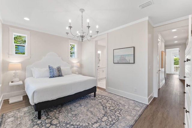 24 Barefoot Ln, Inlet Beach, FL 32461 - bedroom with a chandelier, wood finished floors, ensuite bath, crown molding, and recessed lighting