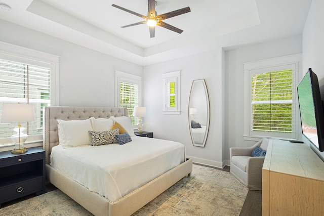 209 Milestone Dr Unit A, Inlet Beach, FL 32461 - bedroom featuring a tray ceiling, light wood-type flooring, and ceiling fan