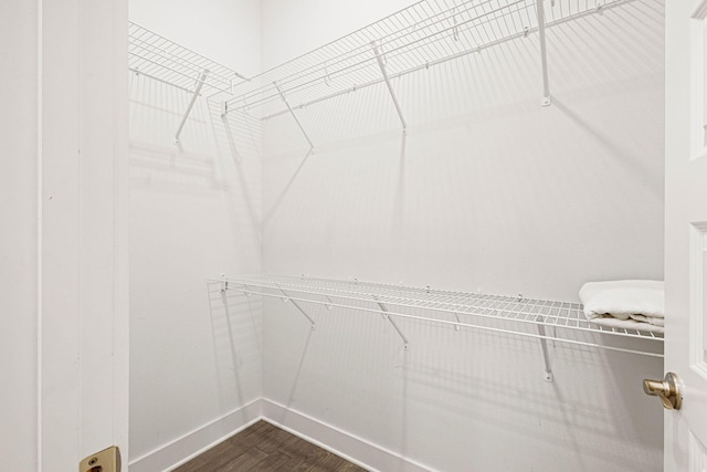 209 Milestone Dr Unit A, Inlet Beach, FL 32461 - spacious closet featuring dark wood-type flooring