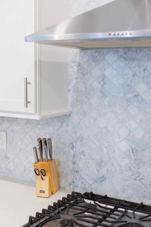 209 Milestone Dr Unit A, Inlet Beach, FL 32461 - kitchen view of wall chimney exhaust hood, white cabinets, tasteful backsplash, and light countertops