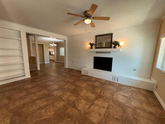905 Cloverdale Ct, Fort Walton Beach, FL 32547 - unfurnished living room featuring built in features, stairs, a textured ceiling, a brick fireplace, and a chandelier