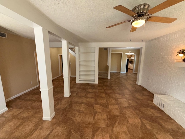 905 Cloverdale Ct, Fort Walton Beach, FL 32547 - unfurnished living room featuring stairway, a textured ceiling, built in shelves, and ceiling fan