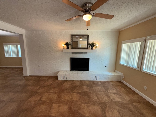 905 Cloverdale Ct, Fort Walton Beach, FL 32547 - unfurnished living room with crown molding, a fireplace, a ceiling fan, a textured ceiling, and brick wall