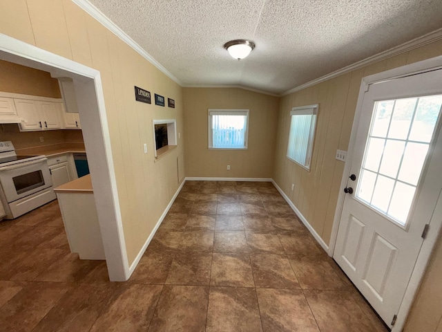 905 Cloverdale Ct, Fort Walton Beach, FL 32547 - entryway featuring ornamental molding, vaulted ceiling, a textured ceiling, and wooden walls