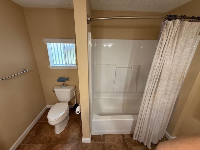 905 Cloverdale Ct, Fort Walton Beach, FL 32547 - bathroom with tile patterned flooring, a textured ceiling, and shower / bath combo with shower curtain