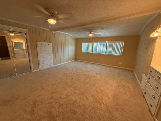 905 Cloverdale Ct, Fort Walton Beach, FL 32547 - unfurnished bedroom with crown molding, light carpet, a textured ceiling, ceiling fan, and wooden walls