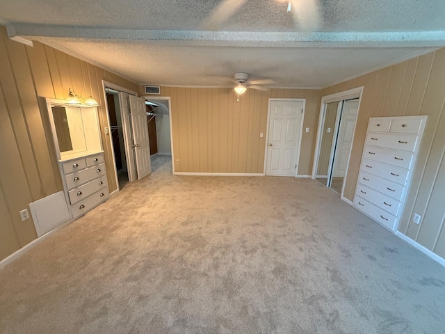 905 Cloverdale Ct, Fort Walton Beach, FL 32547 - unfurnished bedroom with a textured ceiling, wood walls, and carpet floors